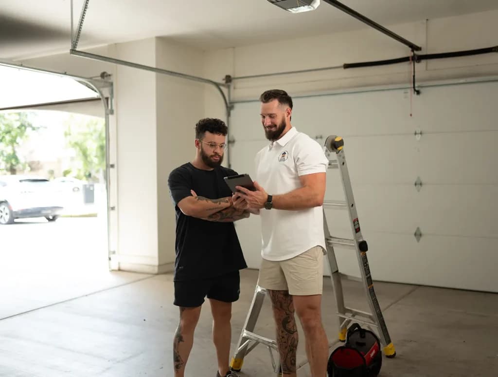 A Local Garage Solutions technician reviewing options with a customer