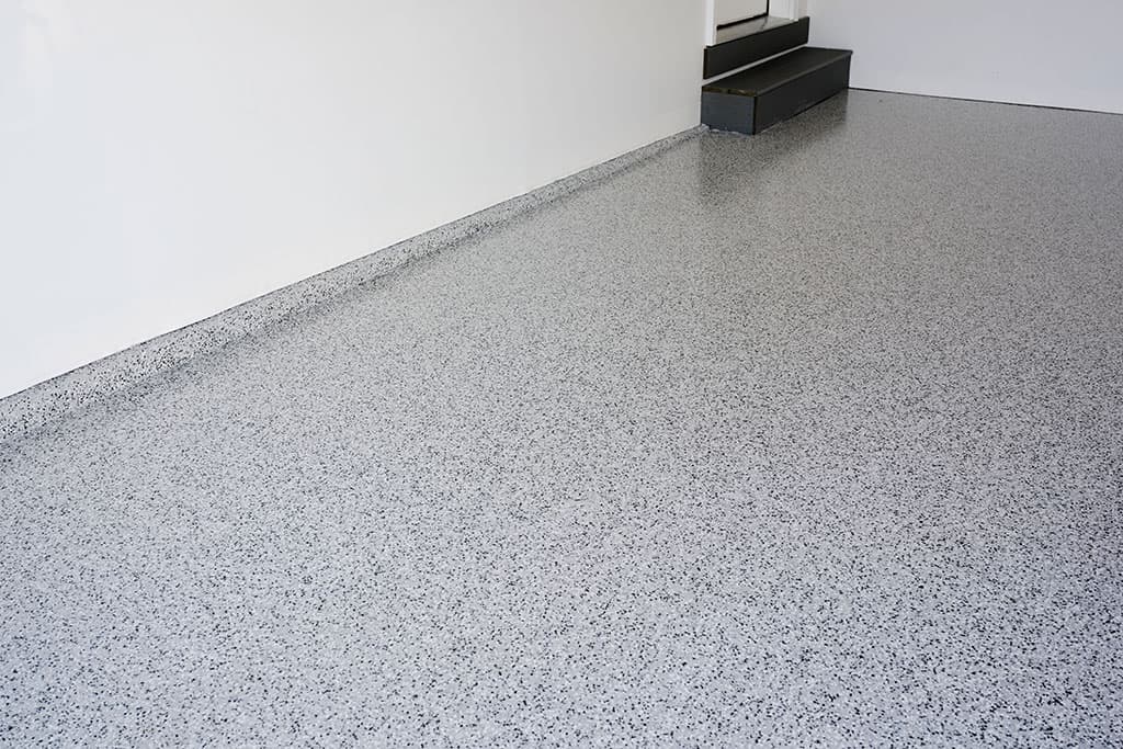 A freshly coated epoxy garage floor finished by Local Garage Solutions